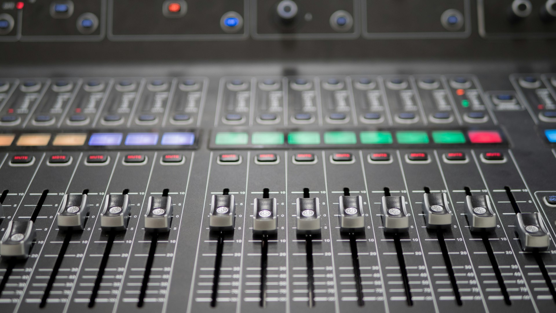 a close up of a sound mixing console